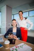 Smiling business executives in conference room