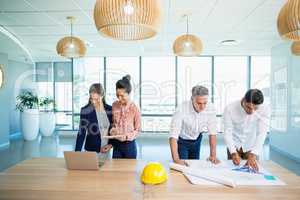 Architects working in office