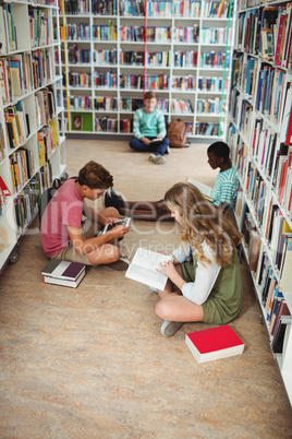 Attentive classmates studying in library