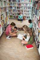 Attentive classmates studying in library