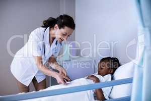 Female doctor checking patient sugar level
