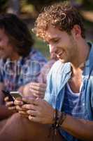 Man text messaging on mobile phone