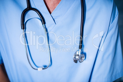 Male doctor with stethoscope in ward at hospital