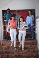 Students moving down staircase