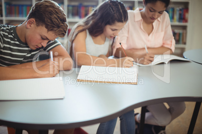 Attentive students studying in library