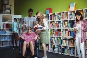 Students interacting with each other in library