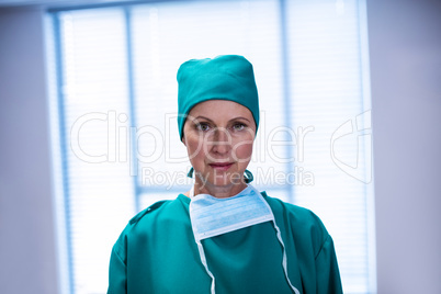 Portrait of female surgeon standing in operation theater