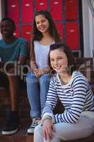 Portrait of students sitting on staircase