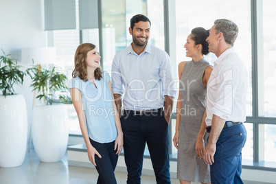 Architects discussing with each other in office