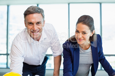 Smiling three architects standing in office