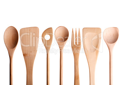 Wooden spoon, spatula, fork on a white background.