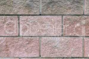 Background image: a fragment of brick wall.