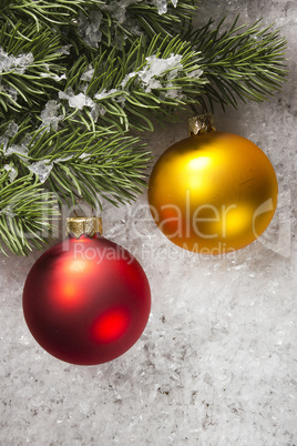 Balls and fir branch on snow