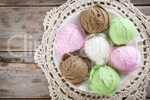 Top view assorted ice cream on wood background.