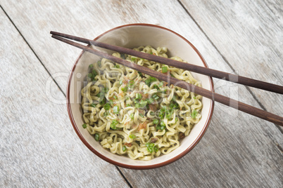 Asian dried ramen noodles bowl top view