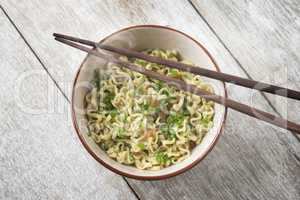 Asian dried ramen noodles bowl top view