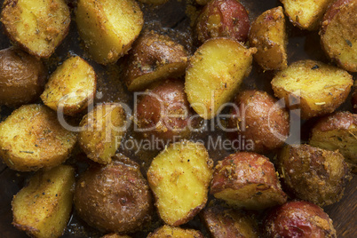 Oven baked potatoes close up