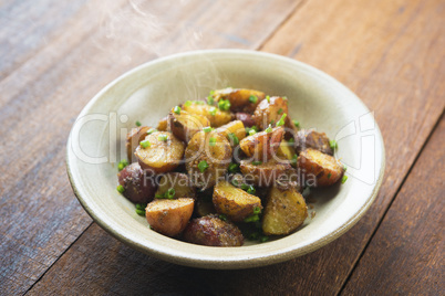 Oven roasted potatoes on wood table