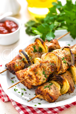 Grilled shish kebab or shashlik on skewers closeup on white background