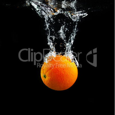 Orange falling into the water