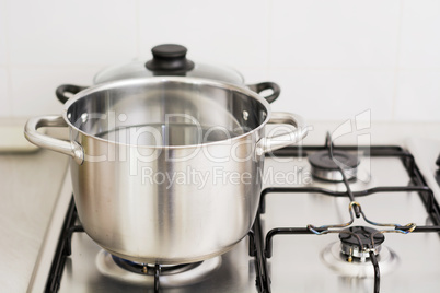 stainless steel cooking pot on gas stove