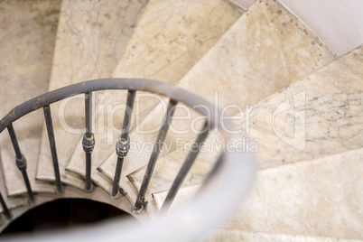 Upside view of indoor spiral winding staircase