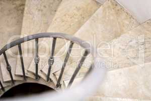Upside view of indoor spiral winding staircase