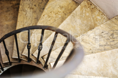 Upside view of indoor spiral winding staircase