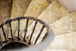 Upside view of indoor spiral winding staircase