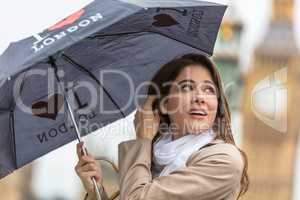 Woman Tourist With Umbrella by Big Ben, London, England