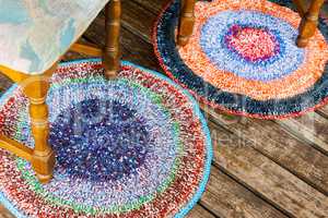 Handmade colorful rugs on a wooden floor