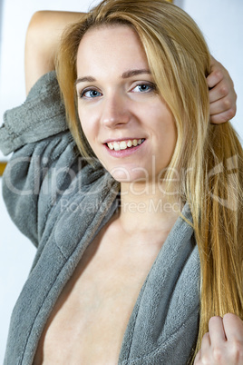 Woman with long blond hair and bathrobe