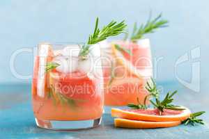 Grapefruit and rosemary gin cocktail, refreshing drink with ice