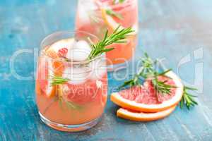 Grapefruit and rosemary gin cocktail, refreshing drink with ice