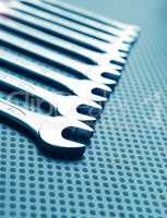 Modern industrial background with wrench assortment