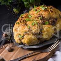 Stuffed cauliflower with mince and Hasselback potatoes