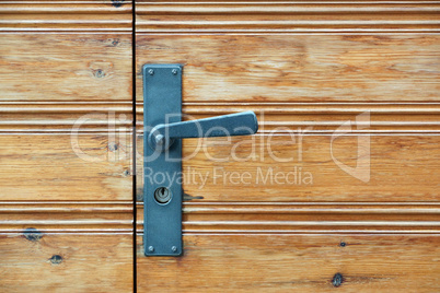 Old wooden door and door handle with lock