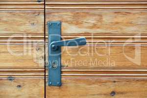 Old wooden door and door handle with lock