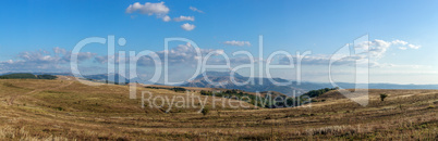 Mountain plateau in the background of the cloudy sky