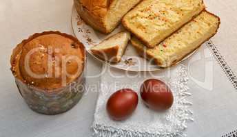 Easter still life: the painted eggs on the napkin and cake .