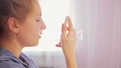 Teen Girl speak to smartphone