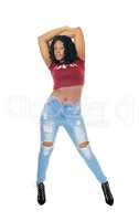 Tall African woman standing in jeans.