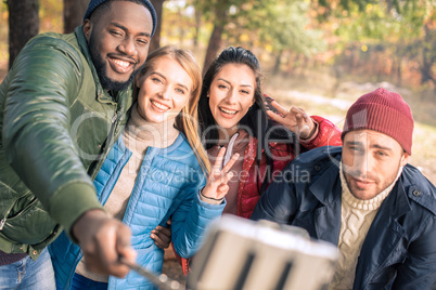 Friends taking selfie in park