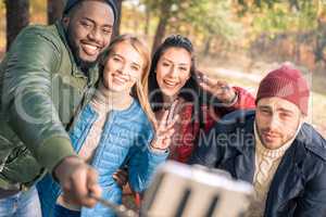 Friends taking selfie in park