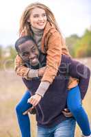 Happy young couple piggybacking