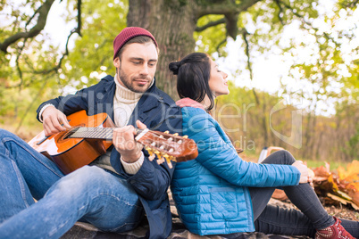 Romantic couple in autumn forest