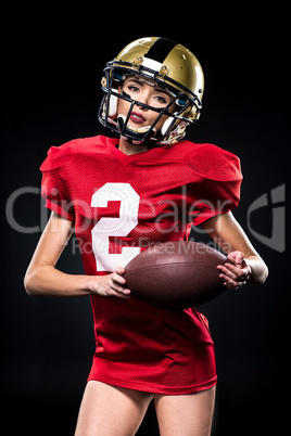 Female football player in helmet