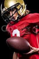 Female american football player in sportswear