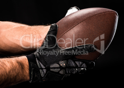 Football player holding ball