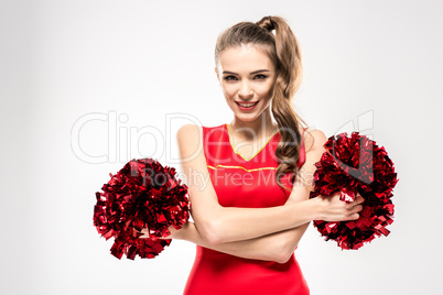 Cheerleader posing with pom-poms